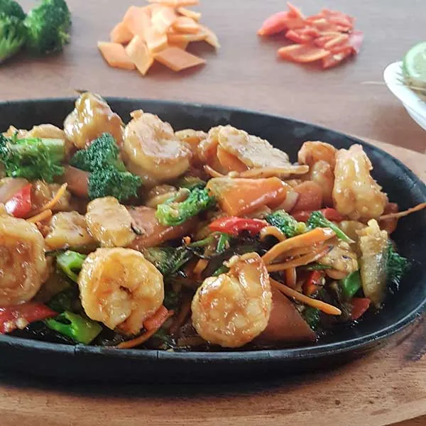 The Mister Wok feast — abundant shared communal table showcasing authentic, intense wok-fired dishes from the Nairobi kitchen