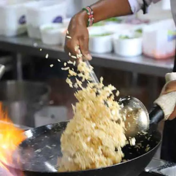 Wok Hei mastery — high-heat wok-tossed premium aromatic long-grain rice at Mister Wok, fired at 300°C